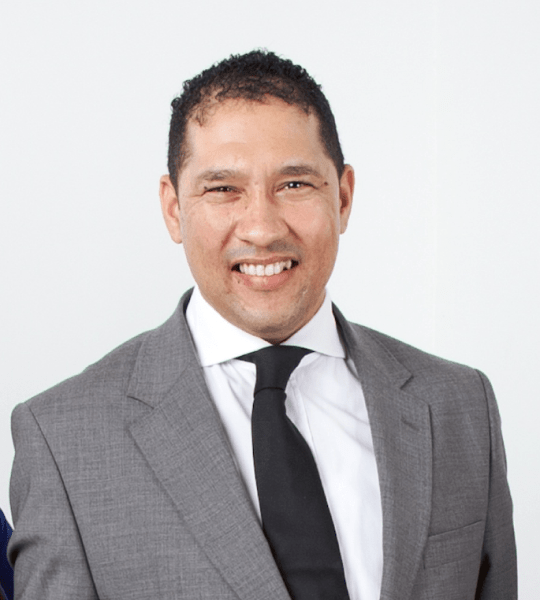 Portrait of a man in a gray suit and dark tie smiling, photo card in the Advanced Slider Layout 6 demo