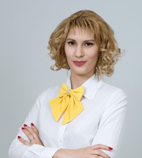 Portrait of a woman in a white blouse with a yellow bow tie, photo card in the Advanced Slider Layout 6 demo