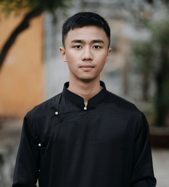 Portrait of a young man in a black collared shirt outdoors, photo card in the Advanced Slider Layout 6 demo